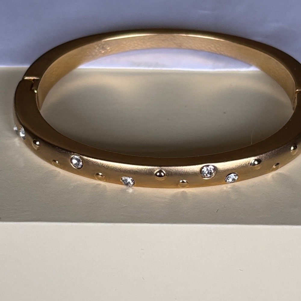 Elegant Gold Tone Bangle with Crystal Accents